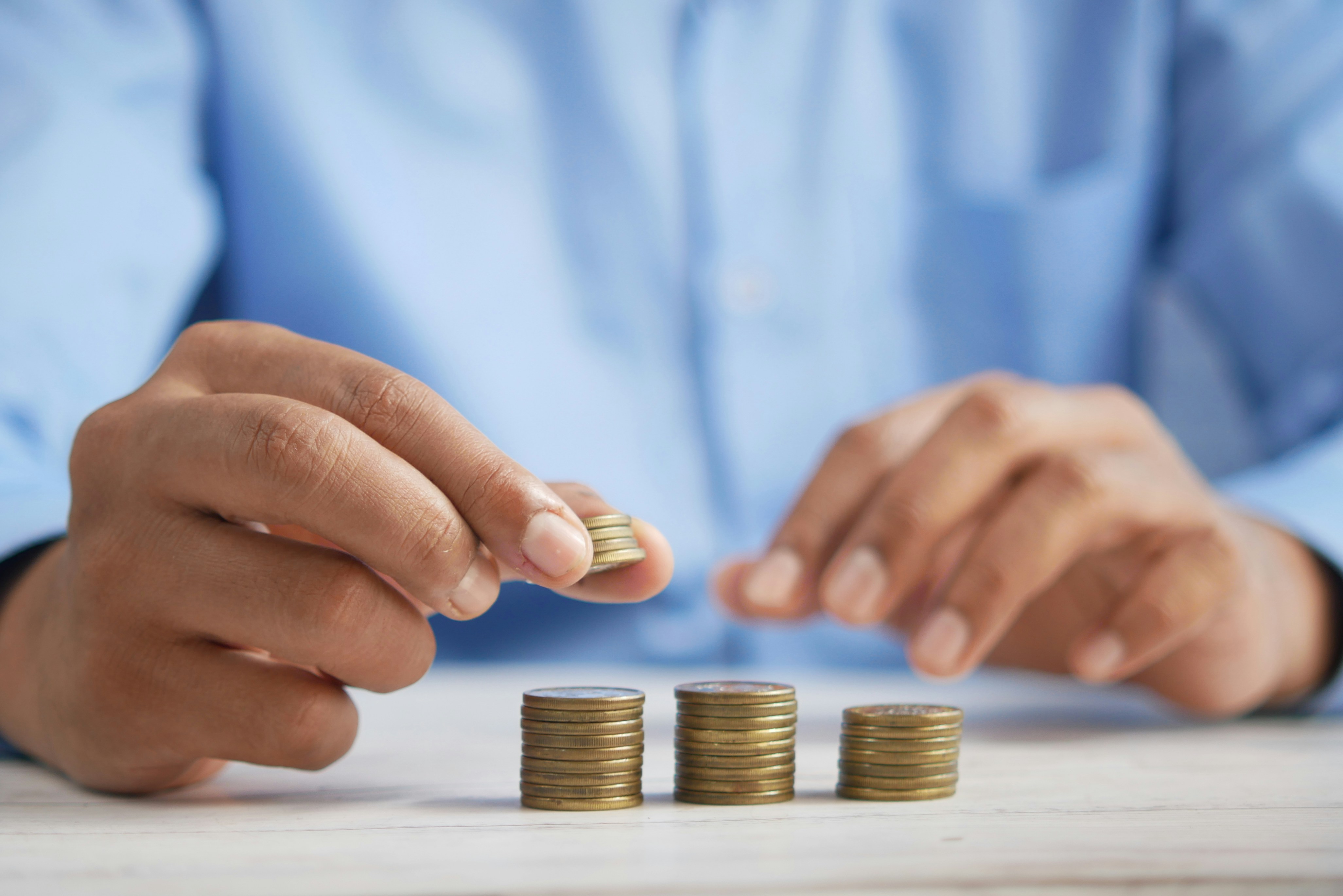 Hands stacking coins
